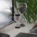 clear hour glass on white table